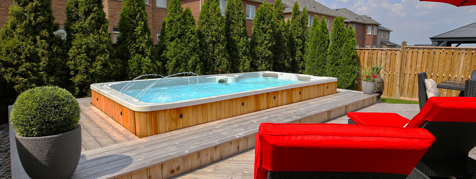 What is a swim spa and how does it differ from a regular pool or hot tub?