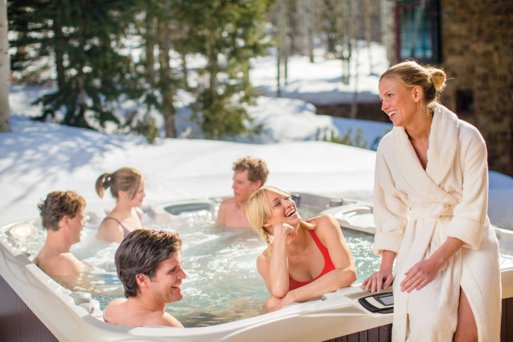 Winter Hot tub Repair in New England allows group of young adults to be in hot tub