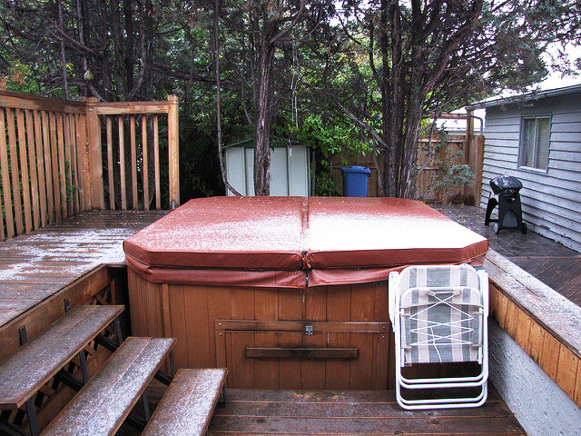 brown covered hot tub in winter