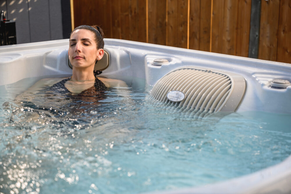 A woman relaxing in a hot tub.